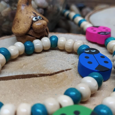 Ensemble bleu collier et bracelet en bois coccinelles pour enfant